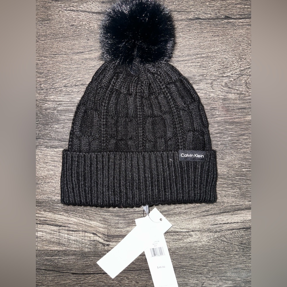 Black Calvin Klein beanie with pom-pom